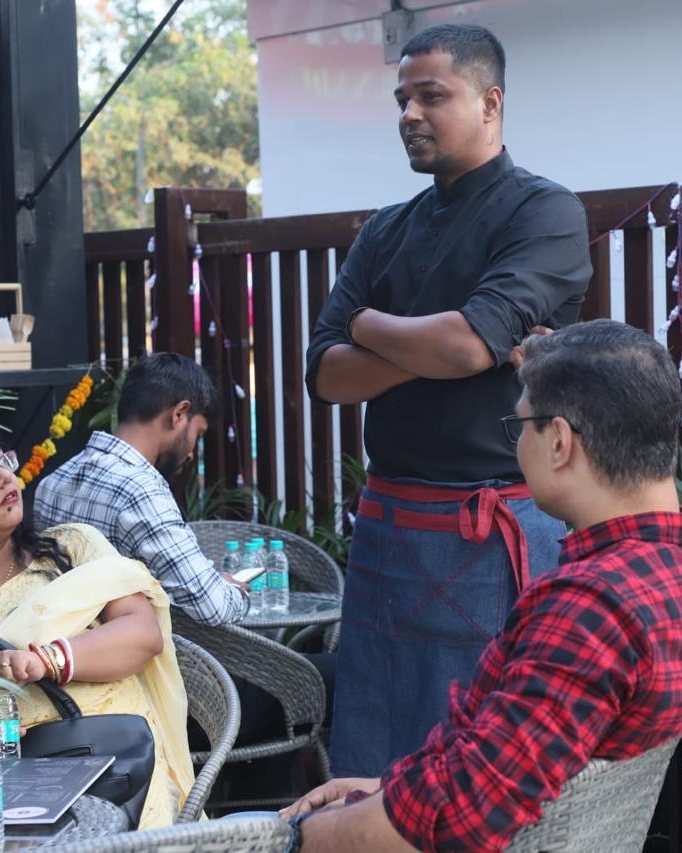 Guests and the team chatting at a community meet-up at the cafe