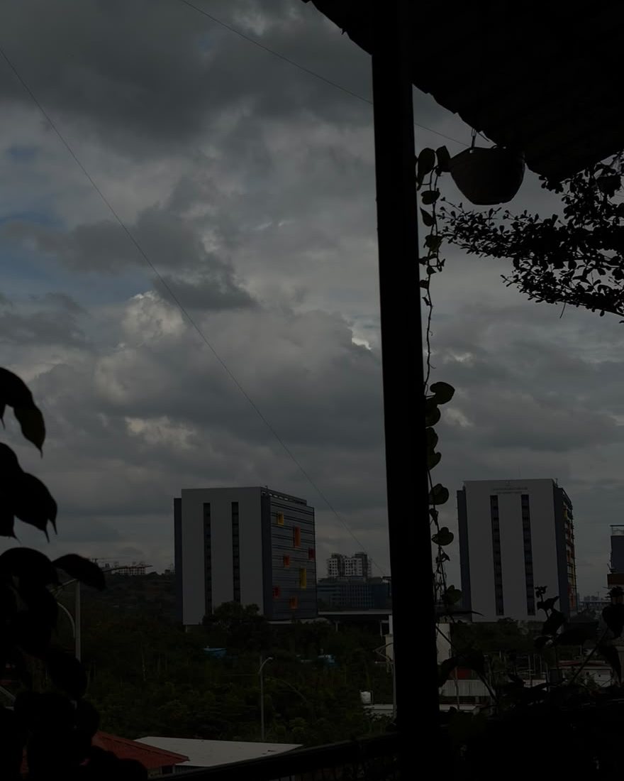 Monsoon clouds over the skyline, seen from the cafe