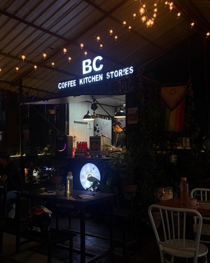 The Brew-Bros Cafe counter at night, lit by fairy lights